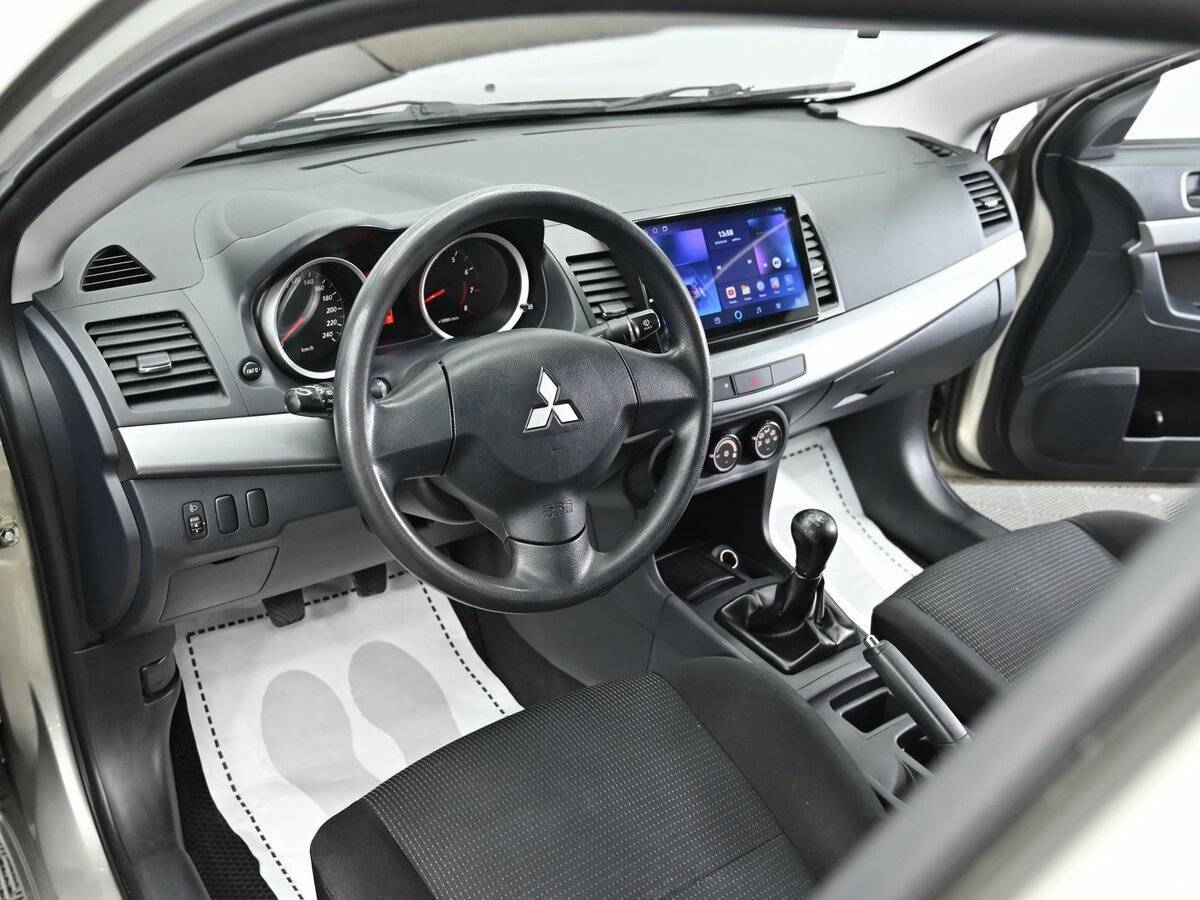 Mitsubishi Lancer с пробегом — 2010 год. Фото: #7