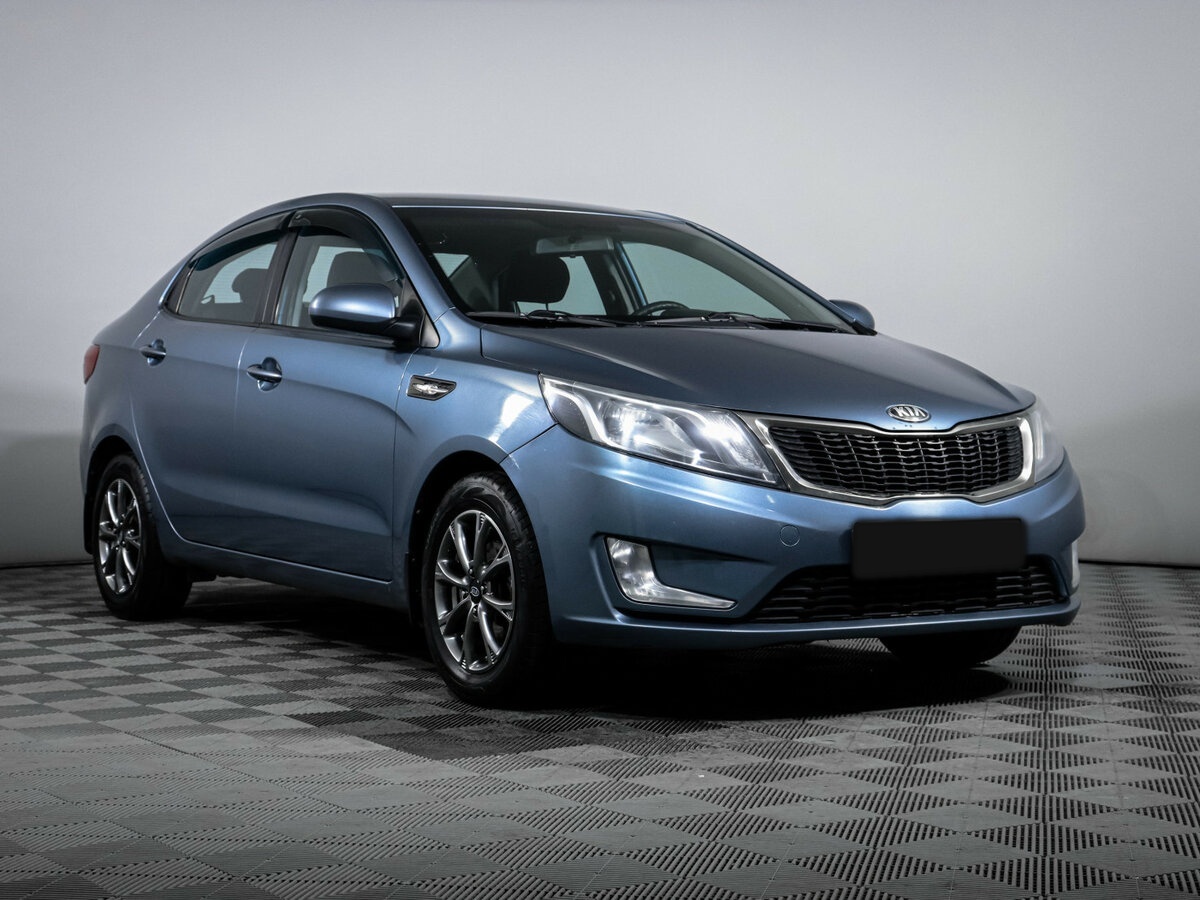 Kia Rio с пробегом — 2013 год. Фото: #2