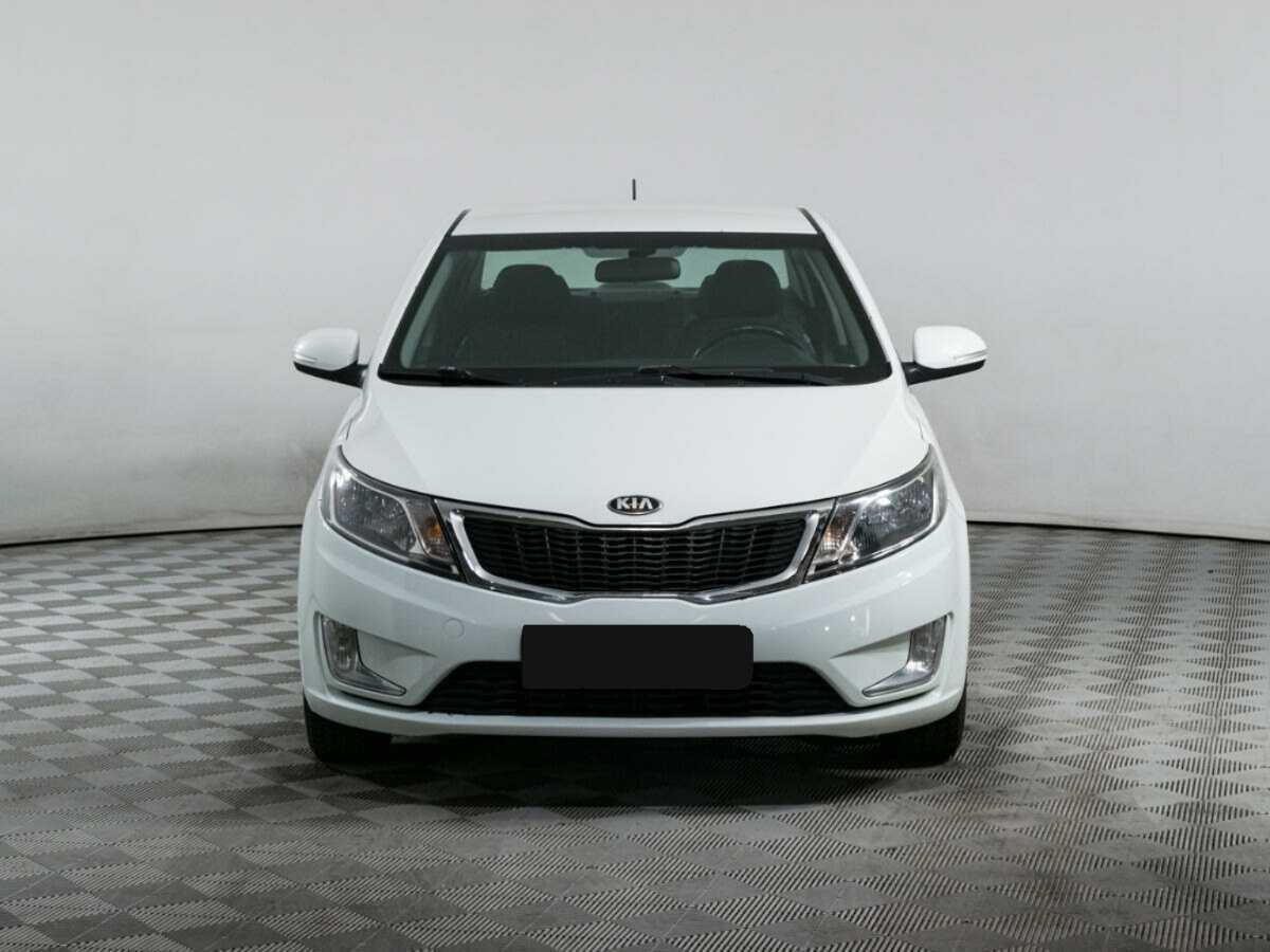 Kia Rio с пробегом — 2013 год. Фото: #1