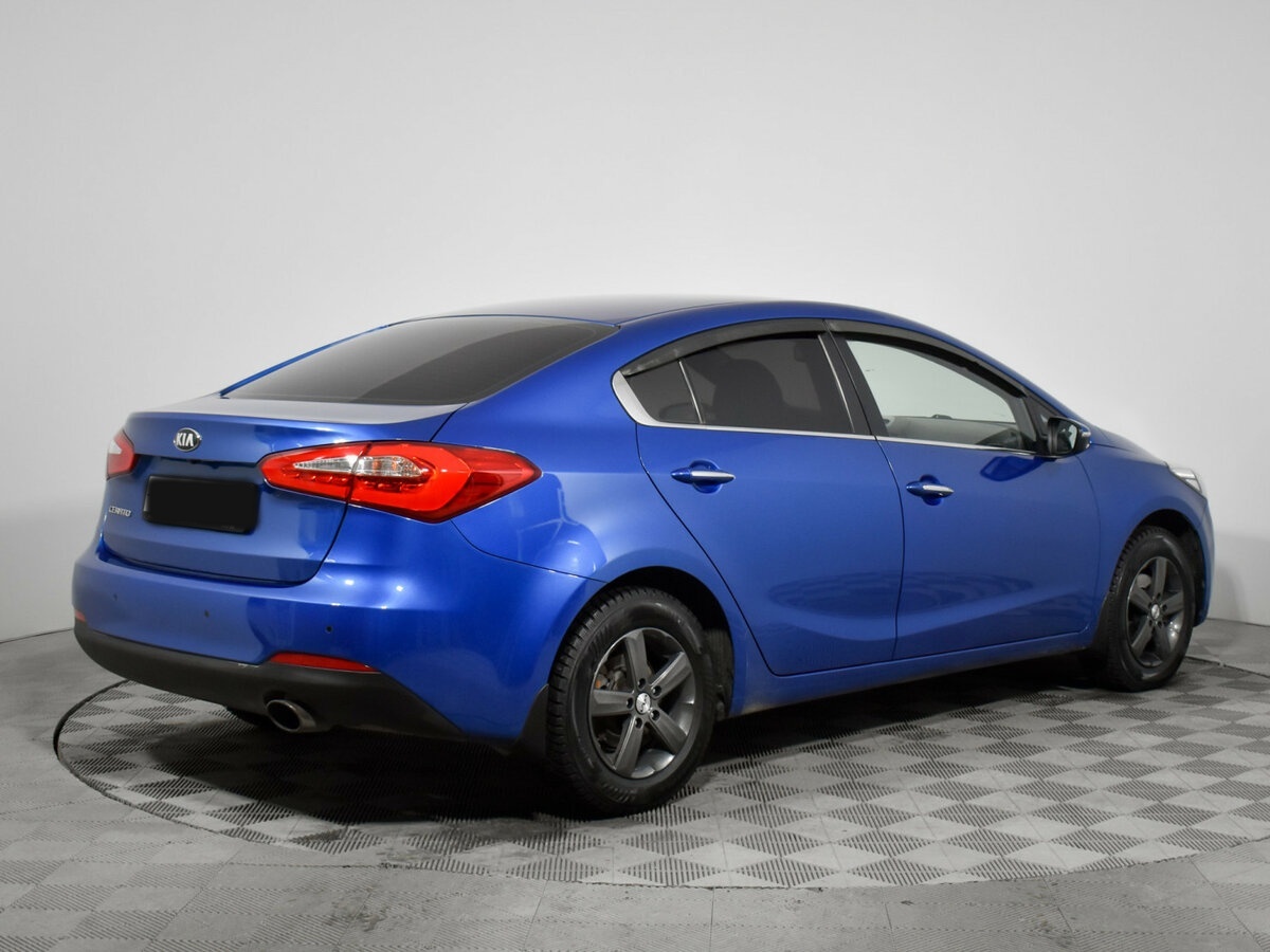 Kia Cerato с пробегом — 2014 год. Фото: #4