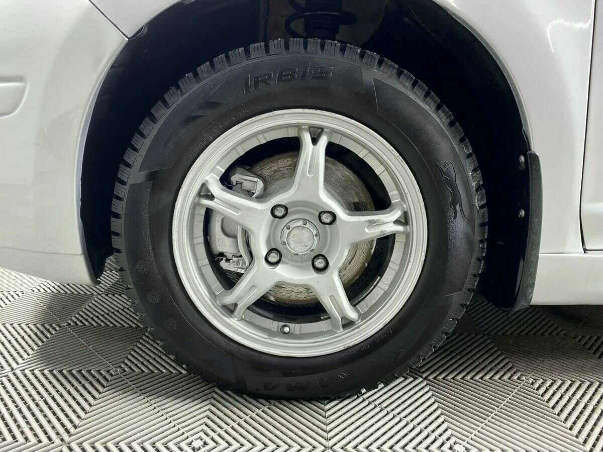 Nissan Tiida с пробегом — 2011 год. Фото: #15