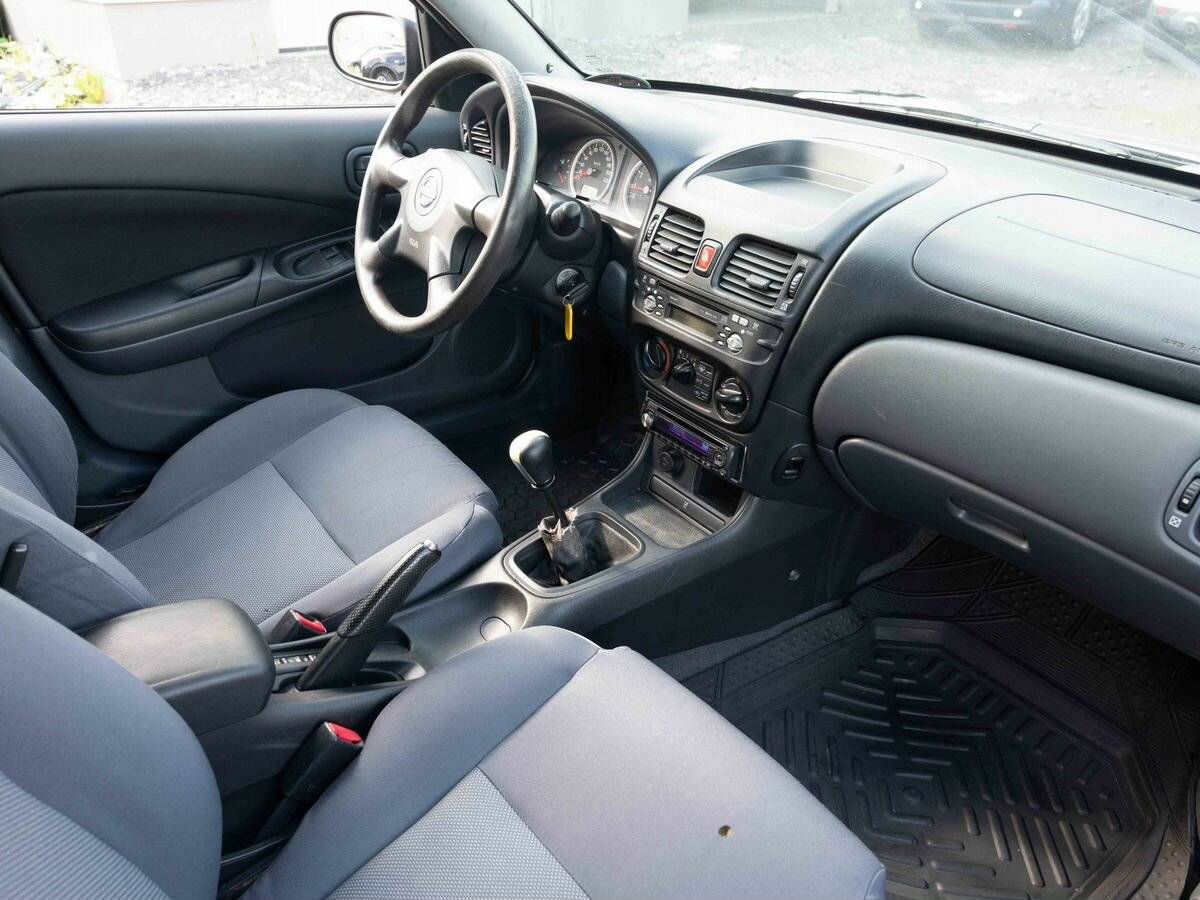 Nissan Almera с пробегом — 2004 год. Фото: #10